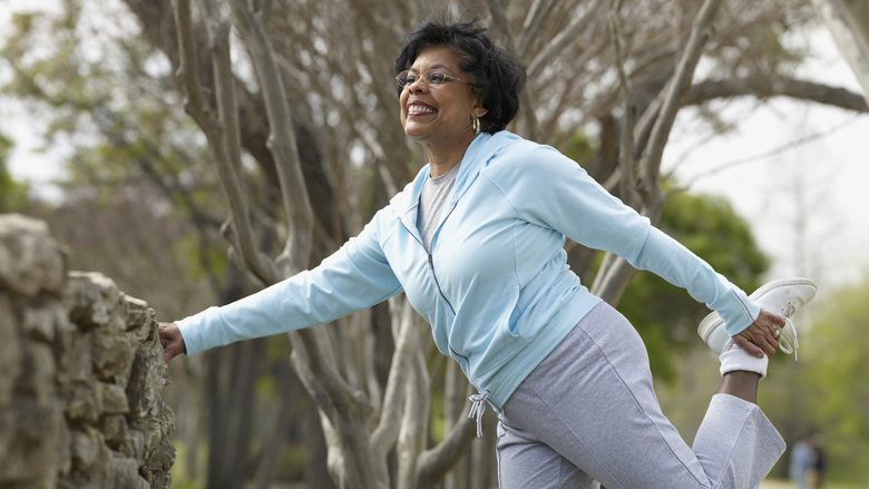 Woman stretching in park